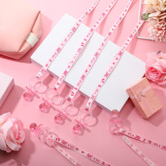 Coume pink pacifier necklaces worn by babies for cute photo moments