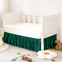 Counfeisly crib skirt with 14-inch drop conceals under-bed storage neatly.