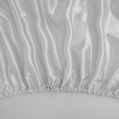 Counfeisly satin sheet laid on mattress highlights temperature-regulating comfort.