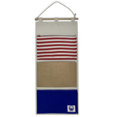 Cruise On fish extender 3-pocket-hanger on cabin door keeps gifts organized for exchanges.