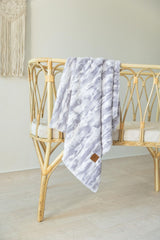Cuddle Cookie Baby Blanket pink option closeup vibrant nursery decor feel