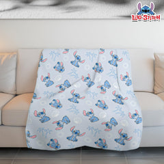 Cudlie Stitch Blanket blue on crib adds cozy warmth.