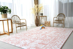 Cushmat Explorer Coral Teal play mat on the floor providing cushioned surface for safe baby play.