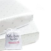 CutieCozy satin crib sheet set in white with hearts and stars, gentle on delicate baby hair.