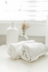 Close-up of CutieCozy satin texture showing smooth surface and hair-friendly feel.