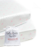 CutieCozy satin fitted crib sheets in packaging, ideal for gifting and on-the-go use.