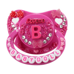 CutiePlusU adult pacifier with Baby Doll decor closeup offers playful comfort for DIY enthusiasts.
