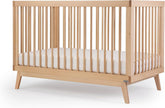 Dadada Soho natural beechwood crib with warm grain and durable finish.