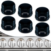 DAFUWENG 6-pack stove knob covers mounted on a gas stove for child safety.