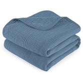 David's Kids baby muslin blanket folded for portability, showcasing soft texture.