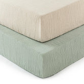 David's Kids muslin crib sheets in oat-milk folded, ultra-soft and breathable.