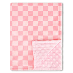 DAYEEBALL pink checkered baby blanket folded for cozy crib time and soft skin comfort.