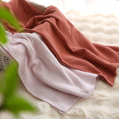 DaysU muslin swaddle multi-use setup shows nursing cover and stroller versatility in action.