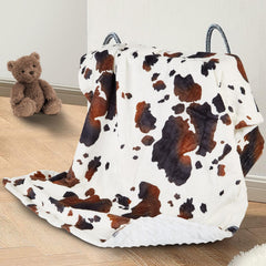 DCOOLGO cow baby blanket in soft fleece provides gentle cozy comfort.