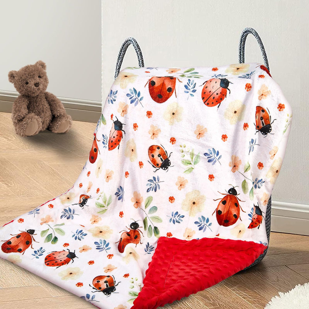 DCOOLGO Ladybug Baby Blanket close-up shows soft fleece for gentle skin comfort during naps.