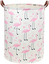 DDBASKET Flamingo Pink Laundry Hamper in a nursery, organizing clothes and toys.