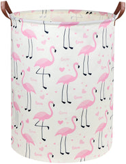 DDBASKET Flamingo Pink Laundry Hamper in a nursery, organizing clothes and toys.