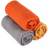 dearjacky orange muslin swaddle folded for easy packing and on-the-go convenience