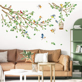 Decalmile birds on tree branch wall decals brighten the living room as a nature-inspired focal point.