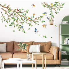 Decalmile birds on tree branch wall decals brighten the living room as a nature-inspired focal point.