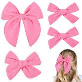 DEEKA hot pink cotton linen bow with alligator clip closeup, gentle on sensitive skin.