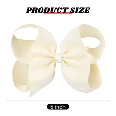 DEEKA ivory solid-color hair bow closeup highlighting clip and ribbon.