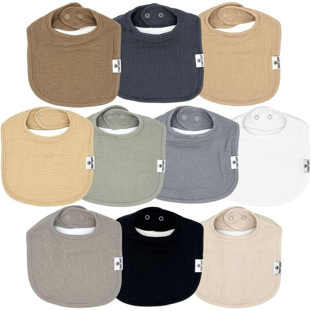 Diaper Squad 10-pack bibs laid flat in neutral colors for easy outfit pairing