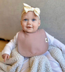 Diaper Squad baby bib closeup highlights ultra-soft fabric that keeps outfits dry.