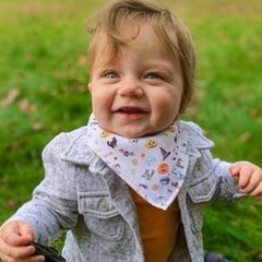 Diaper Squad bib with adjustable snaps grows with baby comfort.