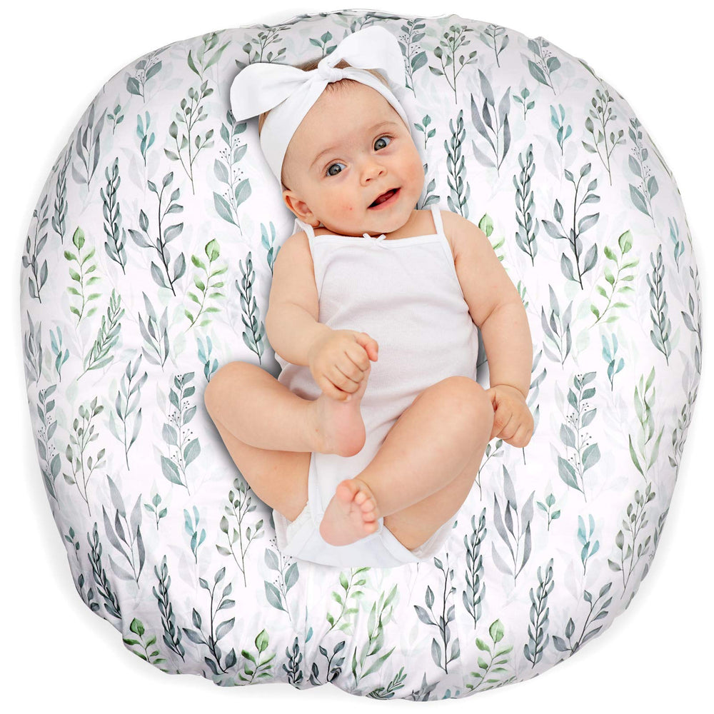 DILIMI newborn lounger cover in green leaf fabric shows soft, breathable nap-time comfort