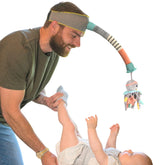 Dingle Dangle headband distractor calms baby during diaper changes.