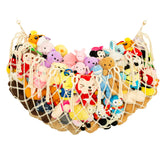 Diocos stuffed animal net on flat wall for space-saving toy storage.