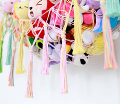 Diocos Toy Hammock Corner Display highlights boho decor and easy toy organization.