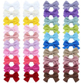 Dizila 2-inch corduroy bows with grosgrain clips for gentle daily wear on infants.