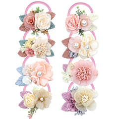 Dizila pink-ivory flower hair tie close-up shows secure hold for toddlers.
