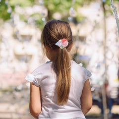 Dizila pink flower hair ties on band styled for cute pigtails