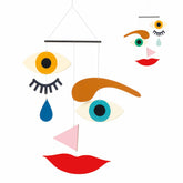 DJECO Make-A-Face Mobile with playful magnetic faces for creative storytelling and visual stimulation.