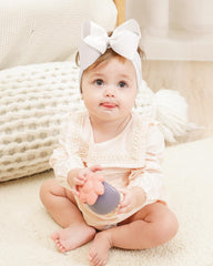 Doboi handmade ribbon bows highlight delicate craftsmanship and charm.
