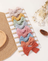 Doboi linen bows with soft nylon band offer gentle everyday wear.