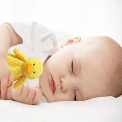 Doindute 14-inch plush in a cozy nursery setting for snuggle.