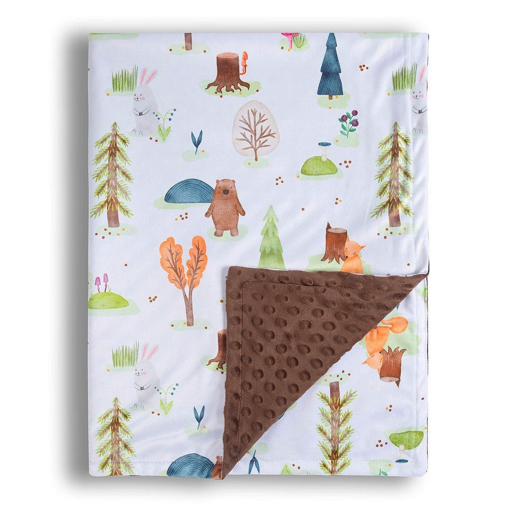 Donsonny forest bear blanket folded on bed shows cozy nap-time warmth.