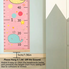 DOOLMIN pink height chart shown hanging in a kid-friendly nursery