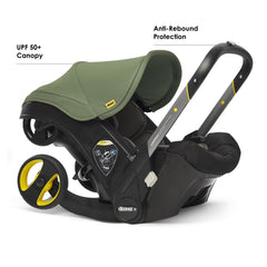 DOONA Desert Green open travel system for effortless car-to-stroller transition.
