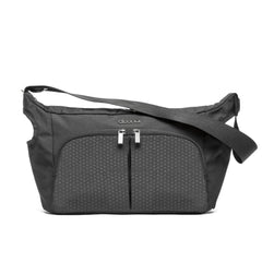 DOONA Essentials Bag Nitro Black attached to stroller for organized on-the-go storage.