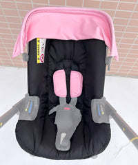 Doona sunshade sunscreen fabric pink demonstrates flexible shade without brackets.