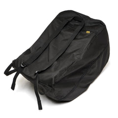 DOONA travel bag black folded with integrated pouch for compact storage