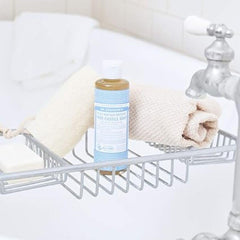 Dr. Bronner's Baby Soap Liquid Castile baby bath scene emphasizes soothed skin and gentle bath time.