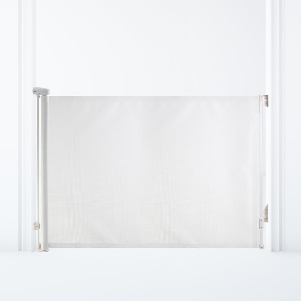 Dreambaby Glide N Hide 55-inch gate extended, securing wide stairways and hallways for safe open-plan spaces.
