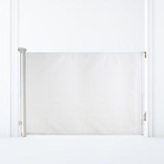 Dreambaby Glide N Hide 55-inch gate extended, securing wide stairways and hallways for safe open-plan spaces.