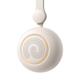 Dreamegg portable sound machine attached to a stroller for on-the-go soothing.